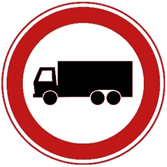 Rond bord met rode rand en een zwarte vrachtauto